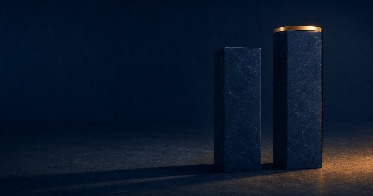 Two navy stone pillars of slightly different heights stand side by side on a navy floor, the taller right pillar capped in warm gold and the shorter left pillar unadorned, illustrating that two insurance quotes on the same risk are rarely the same coverage even when the price looks similar.